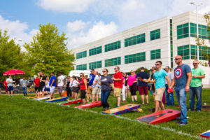 The Rawlings Group employees playing cornhole